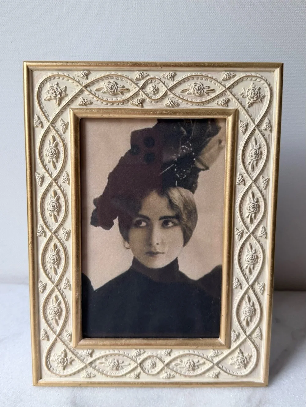 White metal decorative picture frame with gold accents